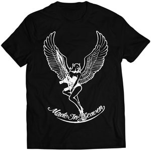 May include: Black t-shirt with a white graphic of an angel with wings holding a rifle. The text "Made In Heaven" is written in a cursive font below the angel.