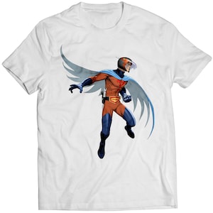 May include: White t-shirt with a graphic of a superhero wearing a red, orange, and blue costume with a white helmet and cape. The superhero is flying with wings.