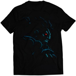 May include: Black t-shirt with a blue and black silhouette of a character with a red eye. The character is facing to the right.