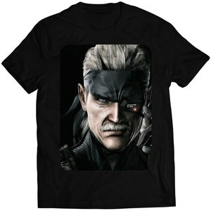 May include: A black t-shirt with a graphic of a man with gray hair and a black eye patch. The man has a mustache and a serious expression. The graphic is in the center of the shirt.
