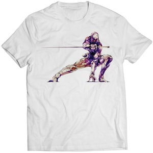 May include: White t-shirt with a purple and white illustration of a video game character holding a sword.