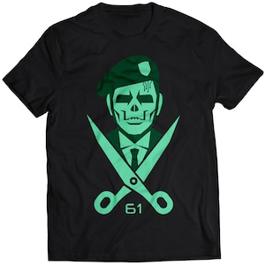 May include: A black t-shirt with a green skull wearing a beret and a pair of crossed scissors with the number 61 printed below.