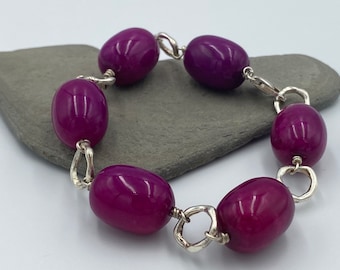 Chunky silver link bracelet with big purple stone beads