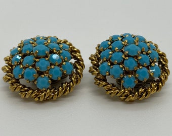Lovely gold colored vintage clip-on earrings with blue stones