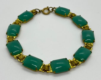 Very fine vintage bracelet, gold colored, with green stones