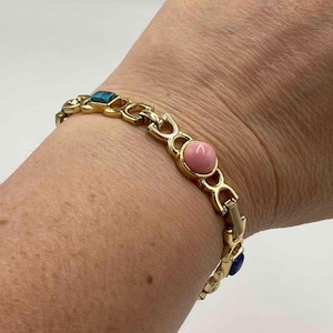 Signed goldtone Sarah Coventry link bracelt with multicolored stones