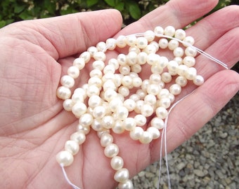 65+ AAA freshwater pearls (mother-of-pearl) white irregular 4-5 mm TIA-40