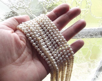 75+ AA, 5mm irregular white freshwater pearls. TIA 121