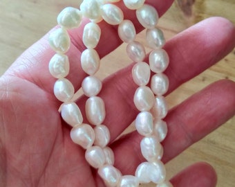 40+ 7-8mm irregular white freshwater pearls. TIA-22