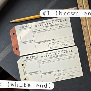 May include: Two vintage United States of America Dispatch Note forms. The top form has a brown edge and the bottom form has a white edge. Both forms have the text "COUPON" and "CUSTOMS STAMP" printed on them.