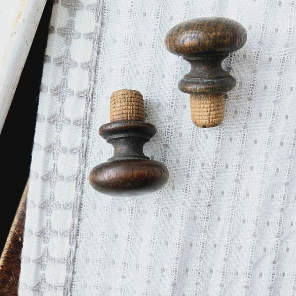 Vintage 2 dark wood knob pieces with rivet peg base, wooden hardware pulls with legs, furniture antique handles with hole plugs, finials