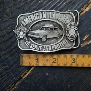 1983 Siskiyou Vintage belt buckle co., silver metal 1980s American lawmen, to serve and protect, 80s police, cop, law patrol, M-27 collector