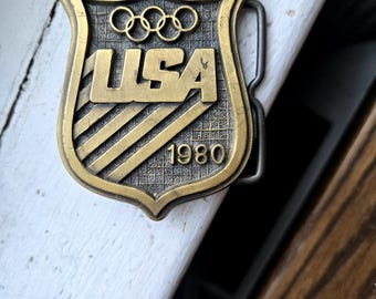 Hebilla de cinturón vintage de 1980 del Comité Olímpico de EE. UU. – Escudo del USOC Paul Rollins Assoc Danbury CT Latón Metal Recuerdos deportivos patrióticos