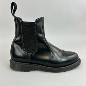 May include: A set of three ceramic mugs with a speckled, matte finish. The mugs are in shades of cream, light gray, and dark gray. Each mug has a simple, minimalist design, perfect for coffee or tea.