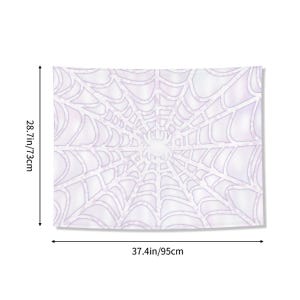 May include: A white tapestry with a spiderweb design. The tapestry measures 37.4 inches wide and 28.7 inches tall. The web design is in a light purple color, with a central focal point.