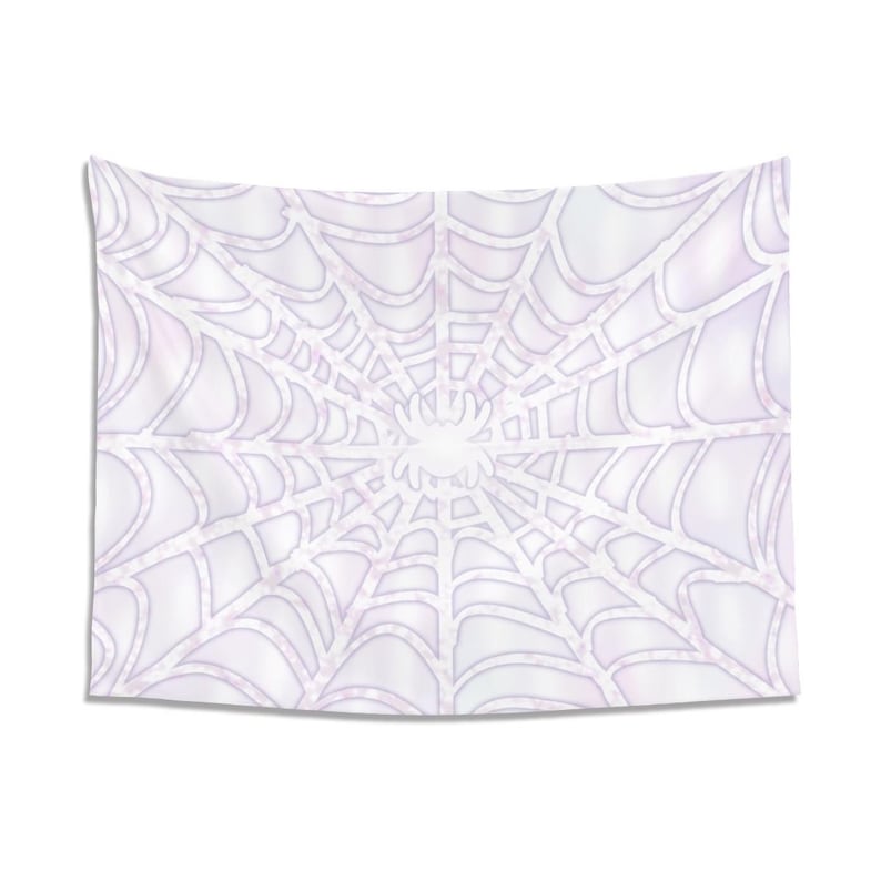May include: White tapestry featuring a spider web design with a spider in the center. The web has a detailed, symmetrical pattern with a light purple hue. The tapestry is rectangular and hangs against a white background.