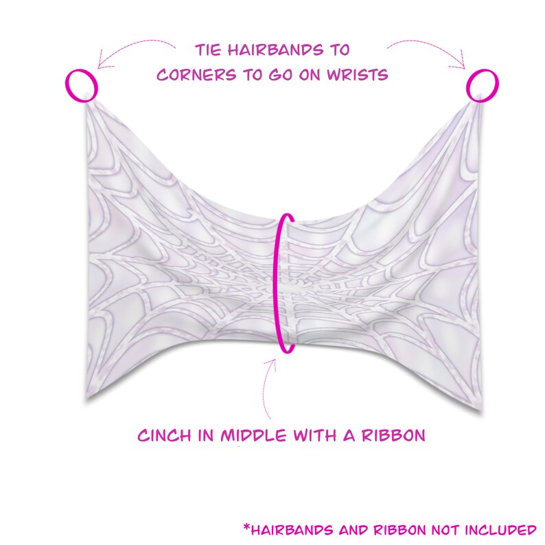 May include: A white fabric with a spiderweb design, cinched in the middle with a pink ribbon. The text reads, "Tie hairbands to corners to go on wrists" and "Cinch in middle with a ribbon." Hairbands and ribbon are not included.
