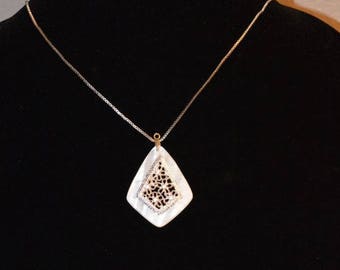 The Abalone: A Necklace of Silvery Flowers on Shimmery White