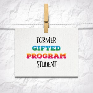 May include: A white card with the text "FORMER GIFTED PROGRAM STUDENT." printed in black. The words "GIFTED" and "PROGRAM" are in rainbow colors.