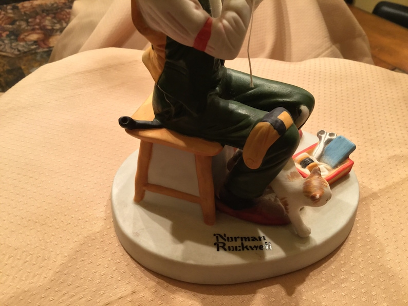 Norman Rockwell Porcelain Figurine Man Threading Needle.