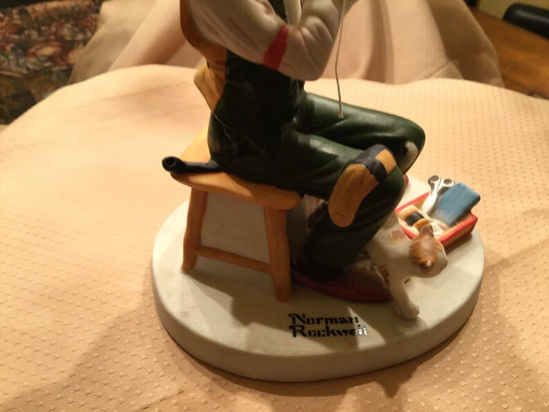 Norman Rockwell Porcelain Figurine Man Threading Needle.