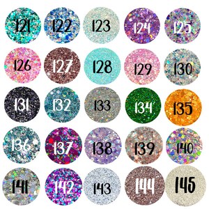 May include: A grid of twenty-five circular swatches displaying various glitter textures and colors, each labeled with a black number from 121 to 145. The collection includes shades of teal, blue, silver, purple, pink, copper, green, orange, and gold.