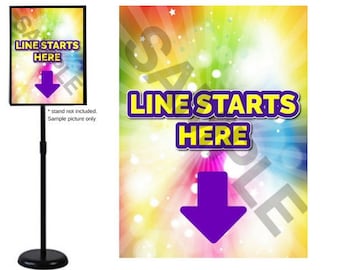 May include: A colorful sign with a rainbow background and white stars. The sign says "Line Starts Here" in yellow letters with a purple arrow pointing down. The sign is on a black stand.