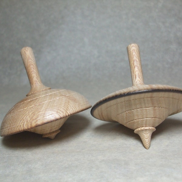 Set of two spinning tops in plane wood, manual turning (manual woodturning)