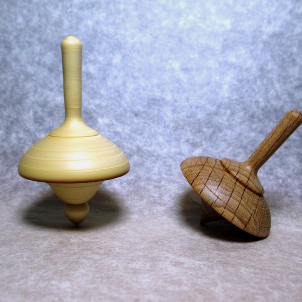 Set of two spinning tops, limewood and beechwood, manual woodturning