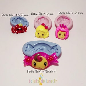 Puede incluir: Cuatro moldes de silicona para hacer dulces o manualidades de resina. Los moldes tienen forma de caramelo, una niña con cabello rubio, una niña con cabello rosa y una niña con cabello castaño. Los moldes están etiquetados con el texto "Petite fille" y el tamaño en milímetros.