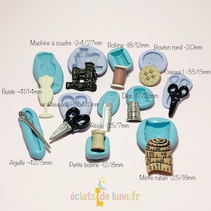 May include: A set of 10 silicone molds for making miniature sewing themed charms. The molds are light blue and feature various sewing tools including a sewing machine, scissors, a thimble, a spool of thread, a button, a measuring tape, and a needle. The molds are labeled with the dimensions of the charms in millimeters.