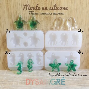 May include: Four white silicone moulds for resin casting, labelled 1 to 4, featuring shapes of sea turtles, jellyfish, seahorses, and starfish. Finished green resin charms are displayed in front of the moulds. Text reads "Moule en silicone" and "disponible en 20/25/30/35 mm".