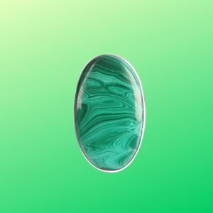 May include: A green malachite gemstone cabochon set in a silver ring.