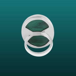 May include: A silver ring with a green malachite stone set in the center. The ring is shown from the back, revealing the setting and the band.