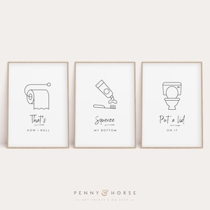 May include: Three black and white illustrations with humorous bathroom-themed text. The first illustration shows a roll of toilet paper with the text "That's How I Roll". The second illustration shows a tube of toothpaste being squeezed onto a toothbrush with the text "Squeeze My Bottom". The third illustration shows a toilet with the lid up and the text "Put a Lid On It".