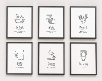 May include: Six black framed prints with white backgrounds and black line drawings and text. The prints feature bathroom-themed illustrations and humorous text. The prints read "So Fresh and So Clean Clean", "Wash Your Worries Away", "Brush it, Brush it Real Good", "That's How I Roll", "Squeeze My Bottom", and "Put a Lid On It".