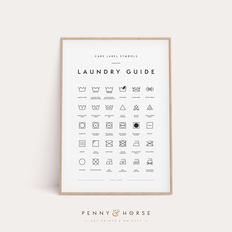 May include: A framed laundry guide print with black and white care label symbols. The print includes text that reads "Care Label Symbols" and "Laundry Guide". The bottom of the print has the text "Penny & Horse Art Prints on Etsy".
