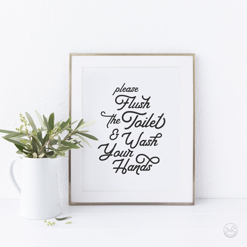 May include: A white framed print with black text that reads "please flush the toilet & wash your hands".