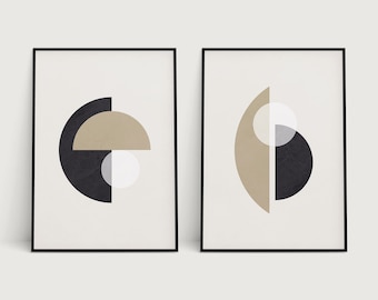 May include: Two framed abstract art prints. Each print features geometric shapes in black, tan, and white against a cream background. The prints are in black frames. The text "PENNY & HORSE - ART PRINTS | ON ETSY" is at the bottom.