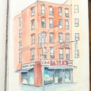 May include: Watercolor illustration of a brick building with multiple windows and a storefront. The storefront has a blue awning and the name "Sable's" in red lettering. A street sign reads "E 76 ST".