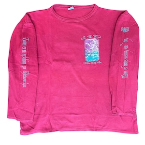 May include: A long-sleeved, magenta-colored shirt with text and graphics. The shirt features text on the sleeves and a central graphic with the words "In The Woods..." and "Island Of The Age".