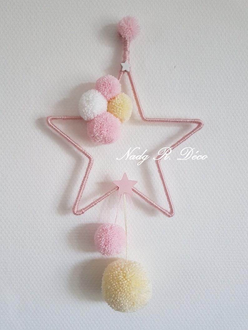 Star and pompoms to hang dream catcher pink, white and yellow artisanal. image 1