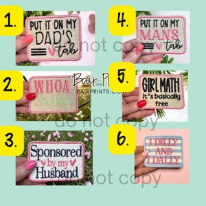 May include: Six rectangular embroidered patches with pink stitched borders. Patch 1 reads PUT IT ON MY DAD'S TAB. Patch 2 reads WHOA Cowboy. Patch 3 reads Sponsored by my Husband. Patch 4 reads PUT IT ON MY MAN'S TAB. Patch 5 reads GIRL MATH it's basically free. Patch 6 reads I DILLY AND I DALLY.