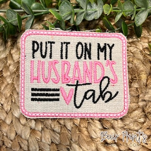 Put it On My Husbands Tab Embroidered Patch.