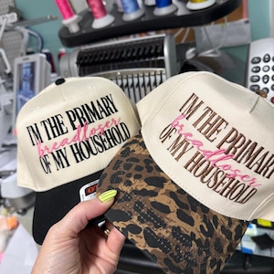 I'm The Primary Bread Loser of the Household Embroidered Hat: Two-Tone Vintage Design, Adjustable Snapback.