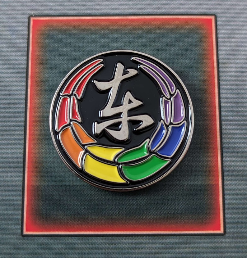 Toji Clan inspired pride enamel pins on an essence of pride NerdyQueer backing card.