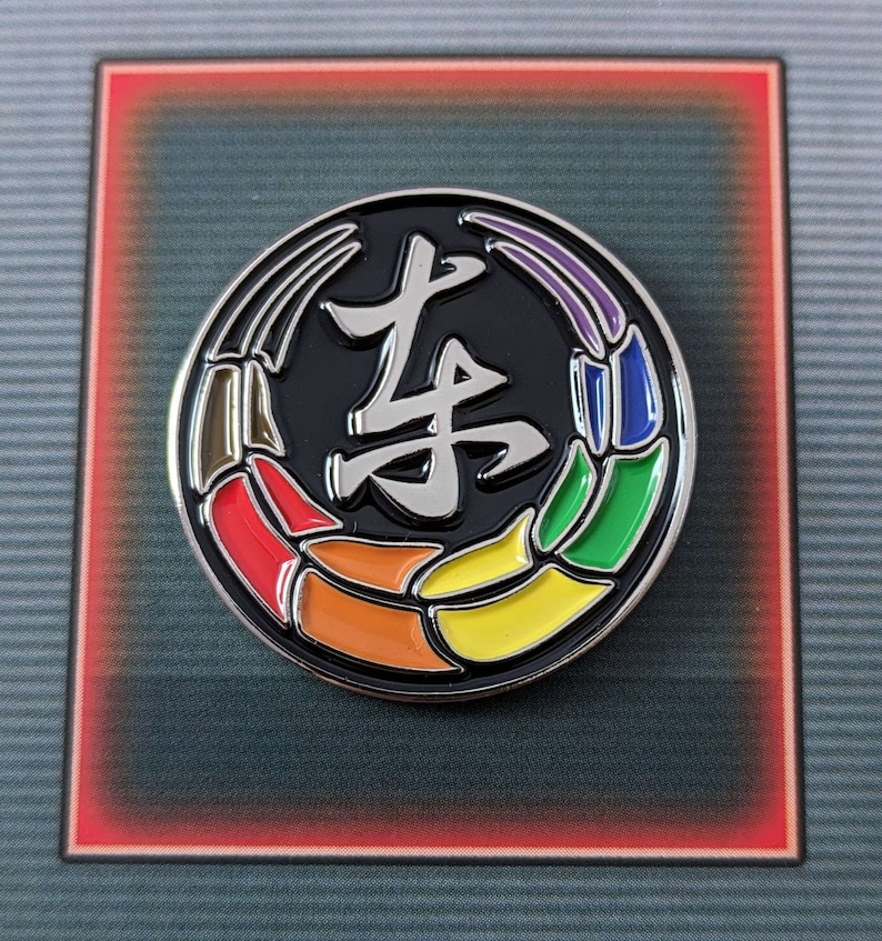 Toji Clan inspired pride enamel pins on an essence of pride NerdyQueer backing card.