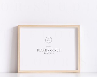 May include: A light wood frame mockup with the text "FRAME MOCKUP" and "The Pixel Press Blog" in black text. The frame is on a white surface.