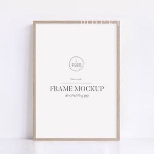 May include: A light wood frame mockup with the text "FRAME MOCKUP" and "files: Psd Png Jpg" in the center of the frame. The text "The Floor Studio" is in a circle in the upper left corner of the frame.