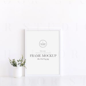 May include: White frame mockup with a white background. The frame is 8x10 inches and has a simple white mat. The text "FRAME MOCKUP" is printed in black below the frame. The text "files Psd Png Jpg" is printed in black below the text "FRAME MOCKUP".